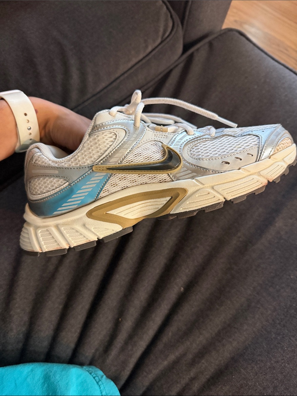 Nike White Mesh Running Shoe with Gold Swoosh & Teal Heel